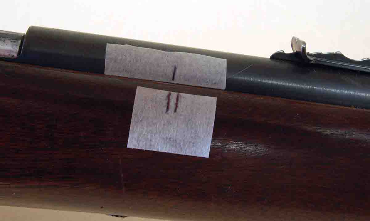 Marks on the tape indicate looseness on this Winchester M67A stock before repair.